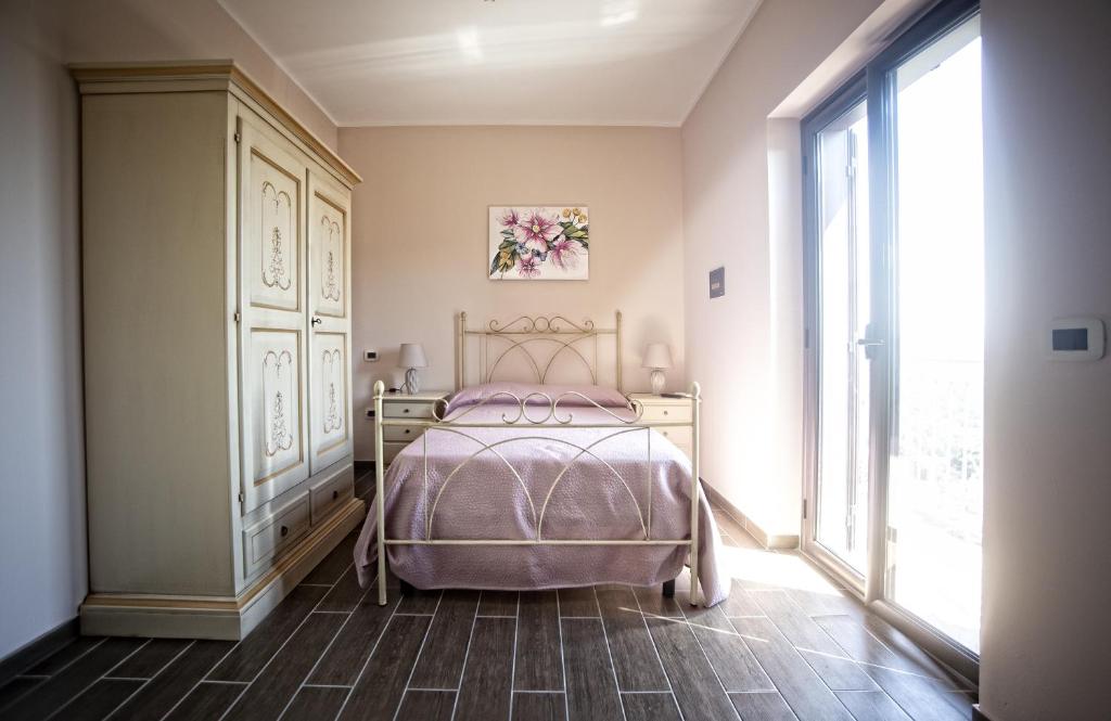 Posteľ alebo postele v izbe v ubytovaní B&B MALVETUM