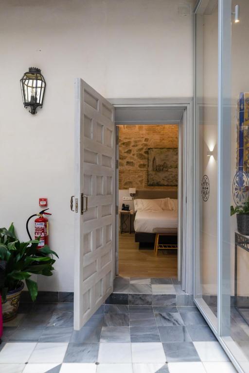 Postel nebo postele na pokoji v ubytování Hotel Boutique Posada de Sillería