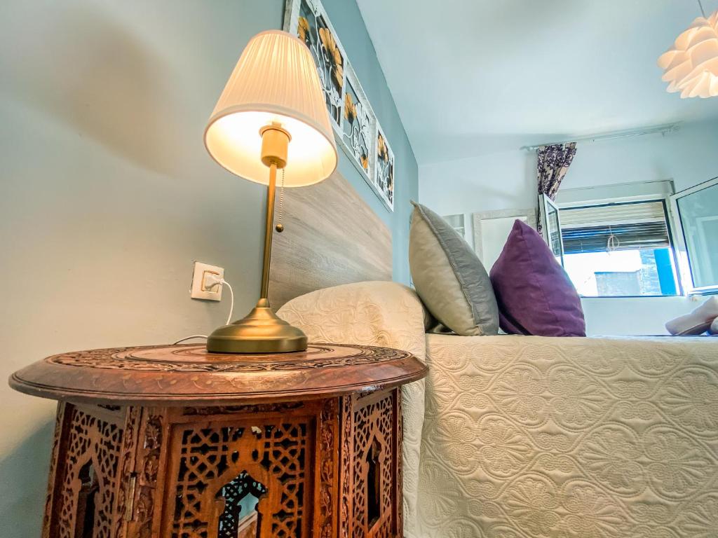 Postel nebo postele na pokoji v ubytování APARTAMENTOS FERNANDO III EL SANTO