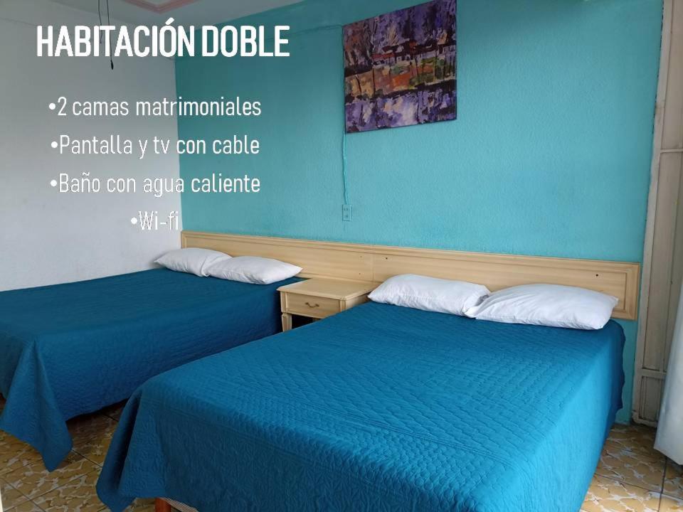 Postel nebo postele na pokoji v ubytování Hotel Viena
