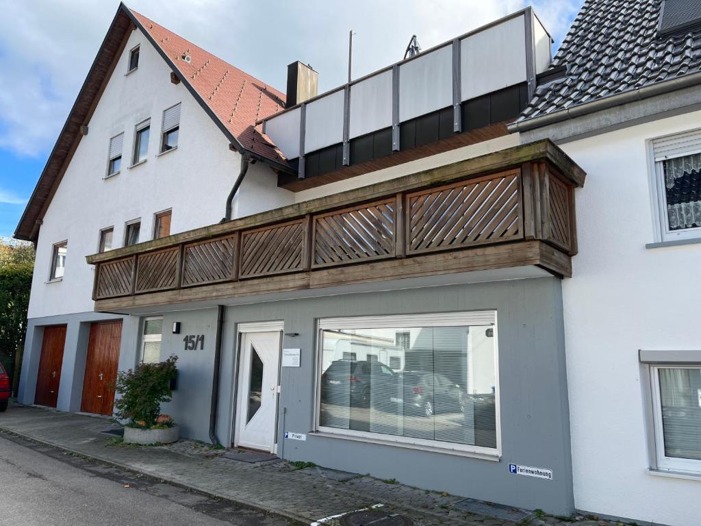 a house with a balcony on top of it at Schwabennestle - Ferienwohnung Albstadt-Onstmettingen in Albstadt