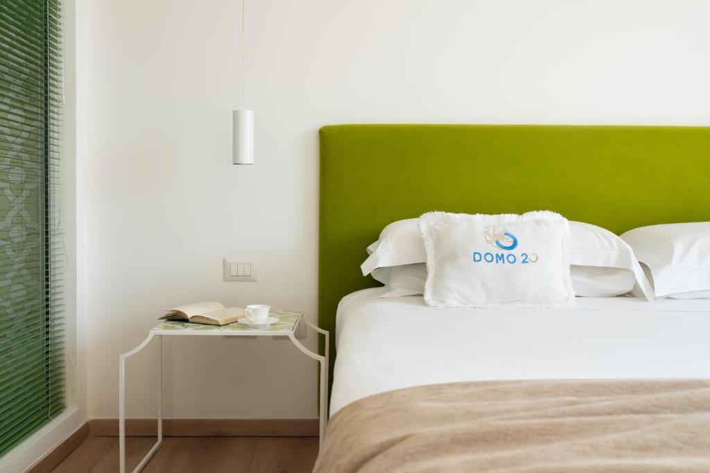 Posteľ alebo postele v izbe v ubytovaní Domo 20 Hotel & Rooftop
