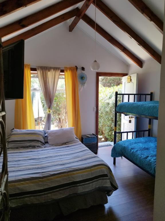 Postel nebo postele na pokoji v ubytování Cabañas Selva Negra