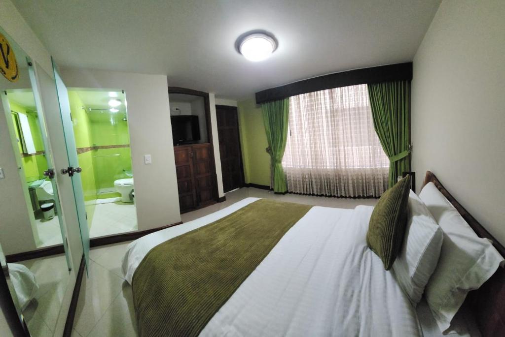 Postel nebo postele na pokoji v ubytování Apartahotel Vincent Suites