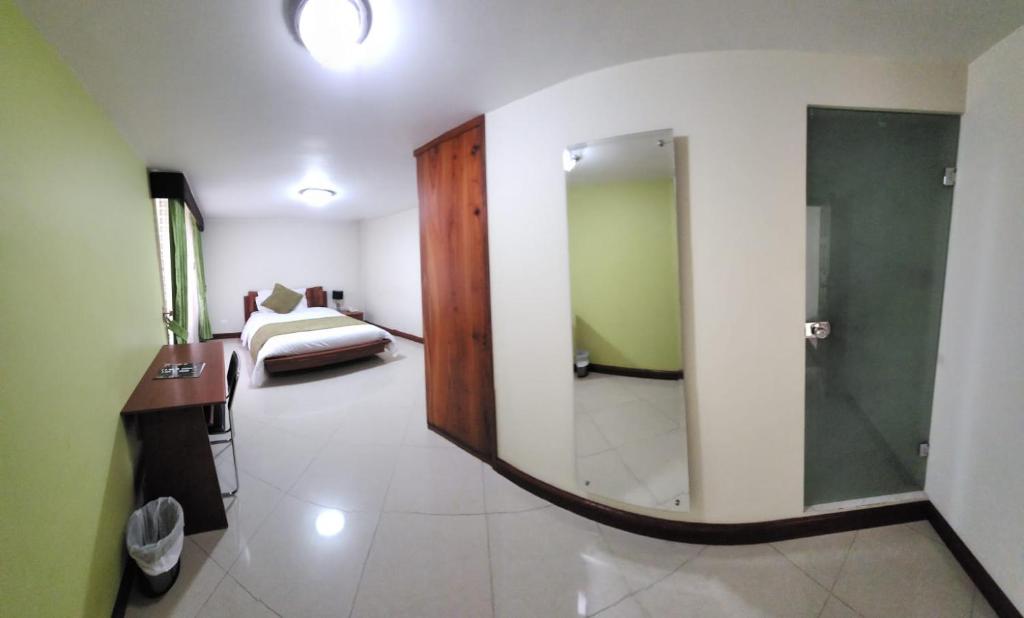Postel nebo postele na pokoji v ubytování Apartahotel Vincent Suites