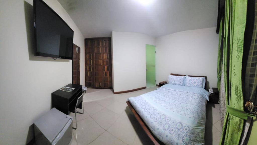TV a/nebo společenská místnost v ubytování Apartahotel Vincent Suites