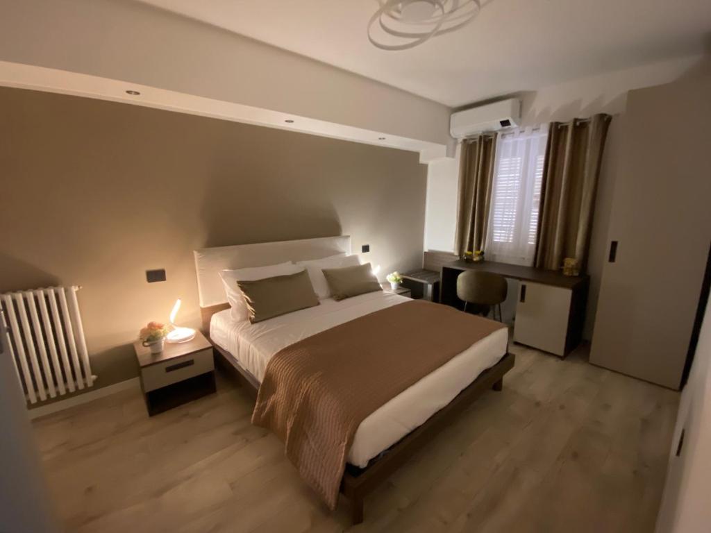 Postel nebo postele na pokoji v ubytování Hotel Plaza Ungheria