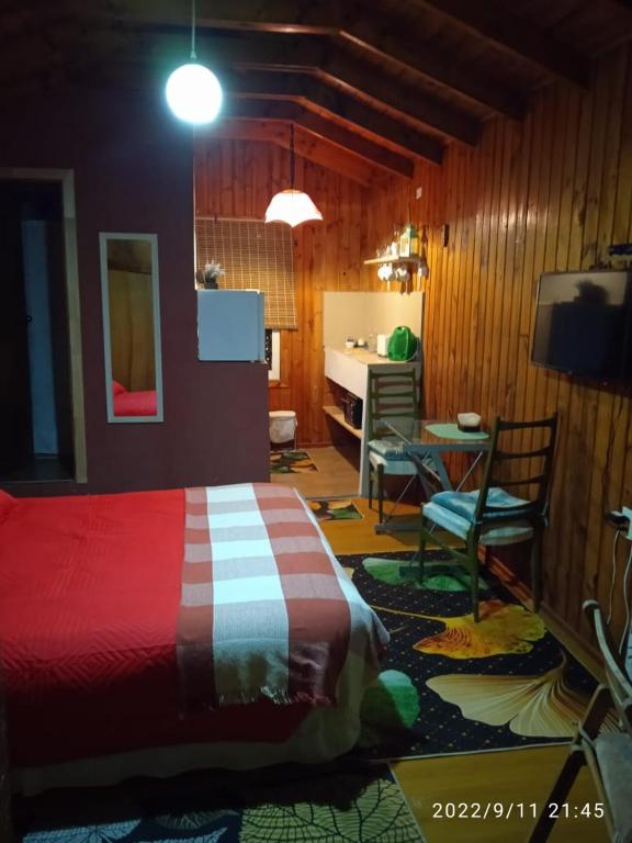Postel nebo postele na pokoji v ubytování Cabañas Selva Negra