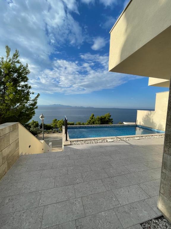 a view of a swimming pool from a house at Korkyra Seashell in Blato