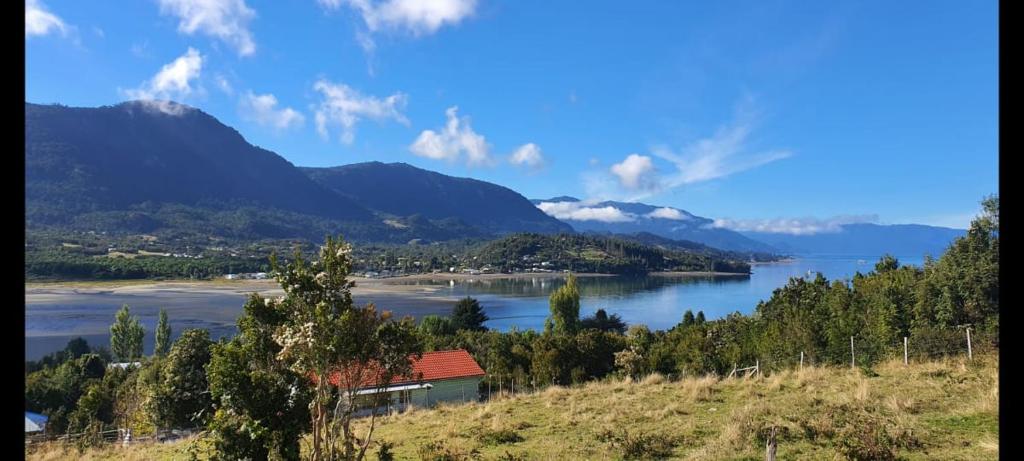 a view of a lake with mountains in the background at Cabañas Chucao Austral in Puerto Montt