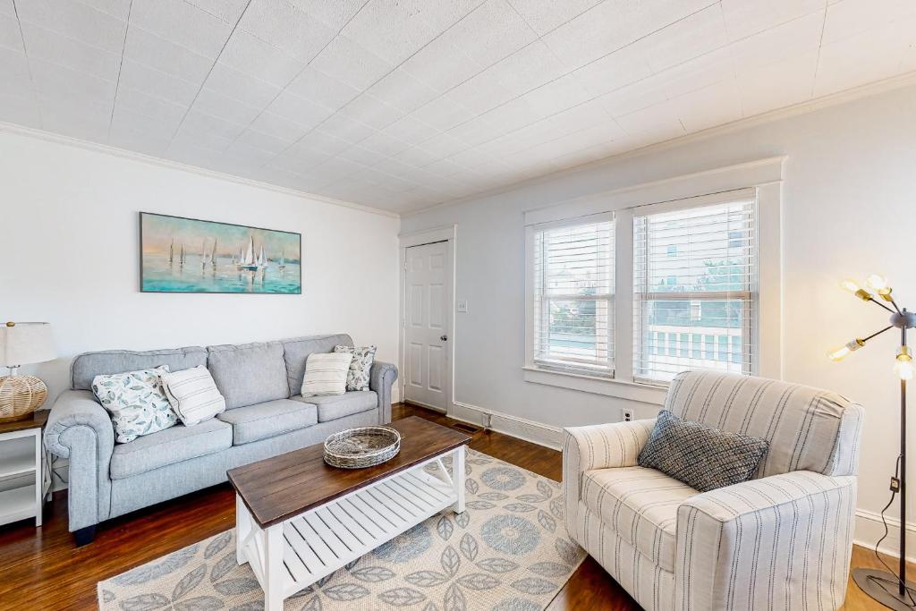 a living room with a couch and two chairs at Ocean City Stunner in Ocean City