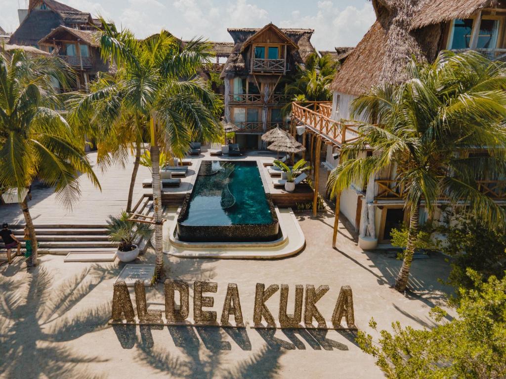 an aerial view of a resort with a swimming pool at Aldea Kuká, Luxury Eco Boutique Hotel - Adults Only in Holbox Island