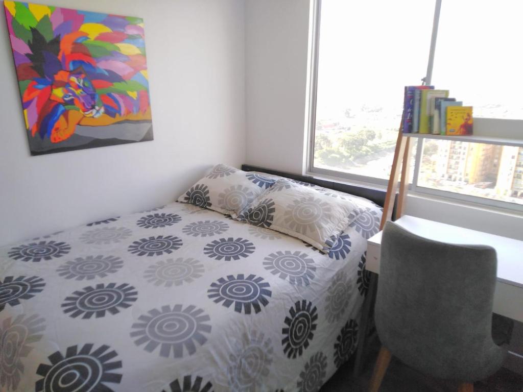 Кровать или кровати в номере Habitación privada cómoda vista Bogotá