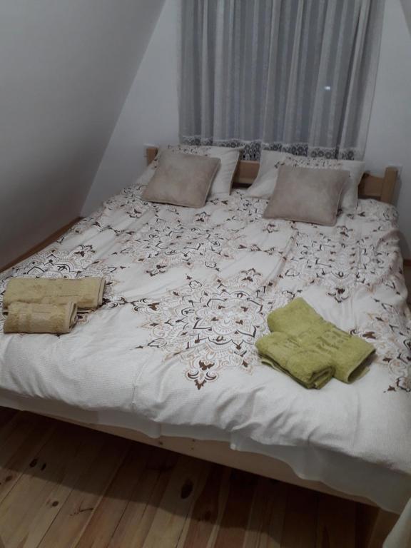 Postel nebo postele na pokoji v ubytování Čivova brvnara