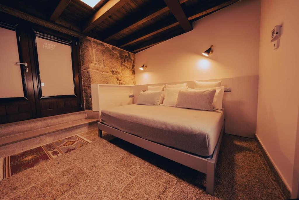 Posteľ alebo postele v izbe v ubytovaní Casa Rural Vilar de Flores