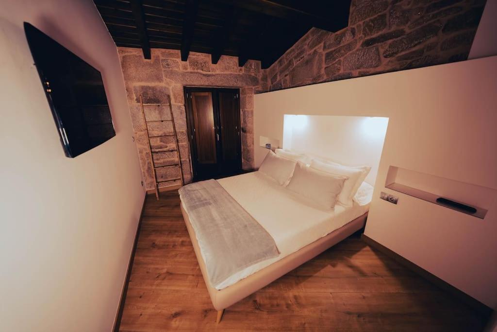Posteľ alebo postele v izbe v ubytovaní Casa Rural Vilar de Flores