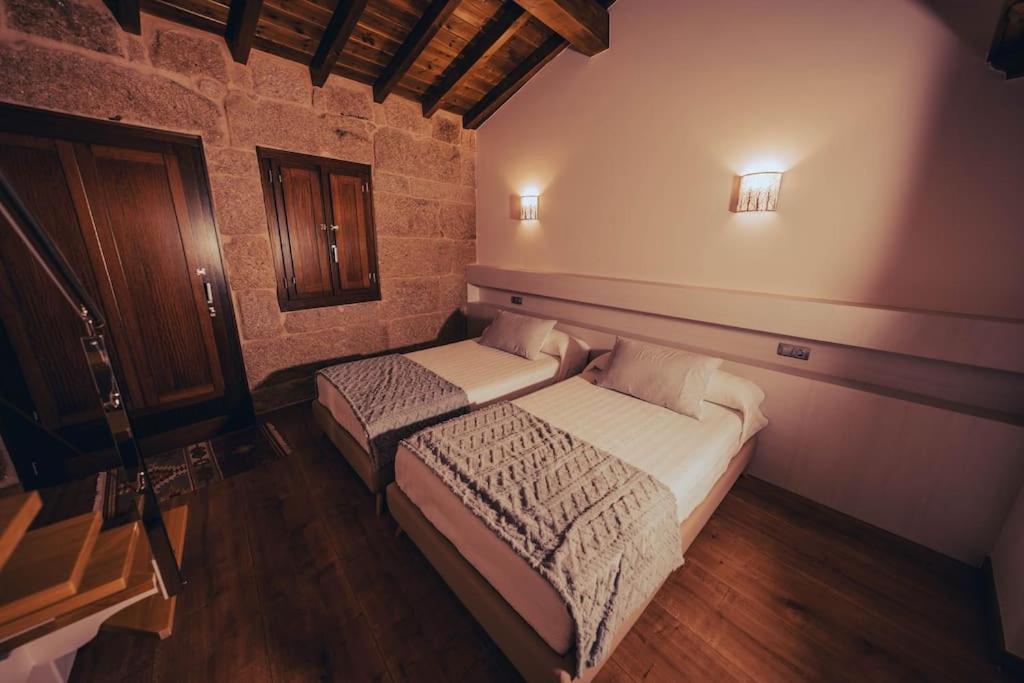 Posteľ alebo postele v izbe v ubytovaní Casa Rural Vilar de Flores