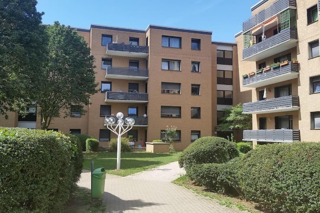 a large apartment building with a pathway in front of it at Ida, the suburban apartment nearby Cologne in Bergheim