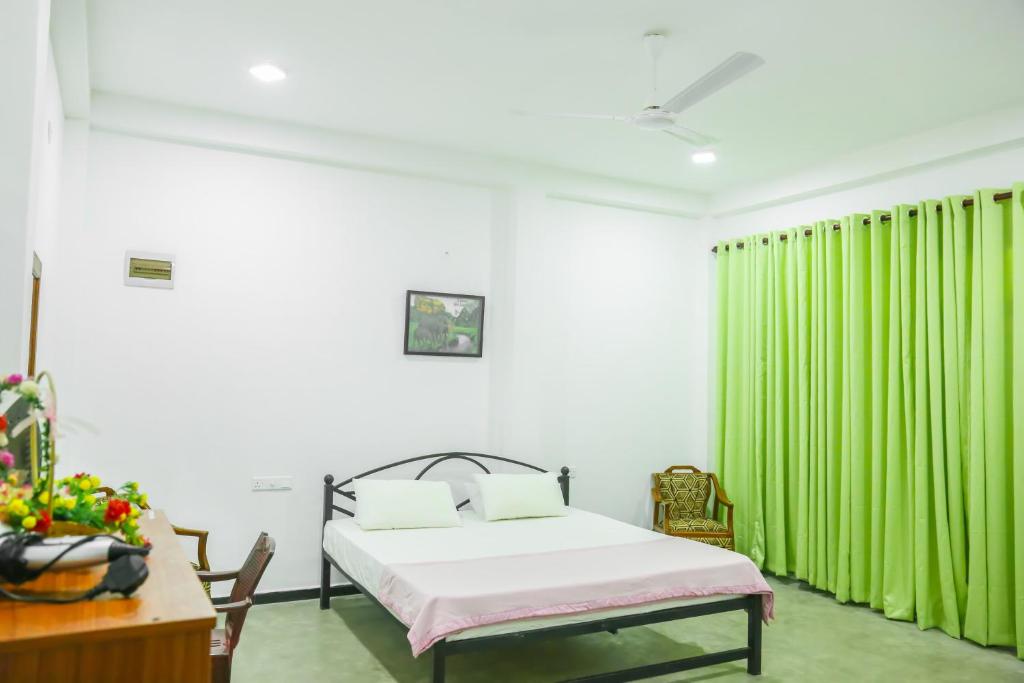Postel nebo postele na pokoji v ubytování Sandy Palms Guesthouse