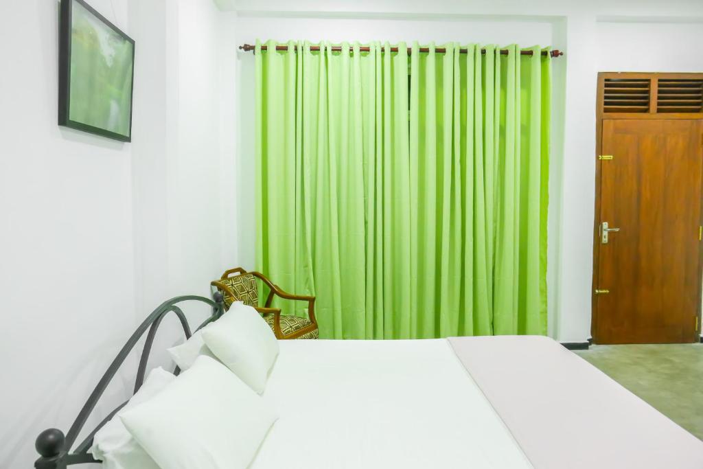 Postel nebo postele na pokoji v ubytování Sandy Palms Guesthouse