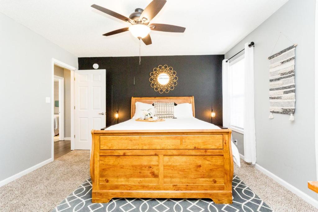 a bedroom with a bed and a ceiling fan at Once-In-A-Lifetime Coffee-Themed Stay For Up To 8 in Clarksville