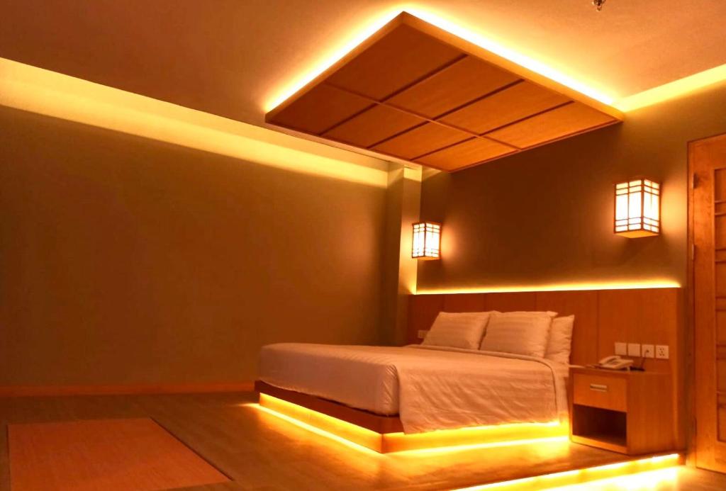 Letto o letti in una camera di UNUMA HOTEL