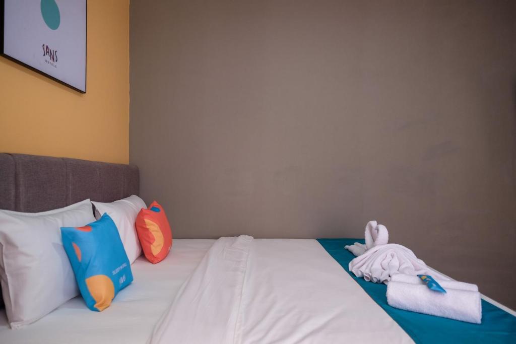 Postel nebo postele na pokoji v ubytování Sans Hotel Fourth Loft Solo