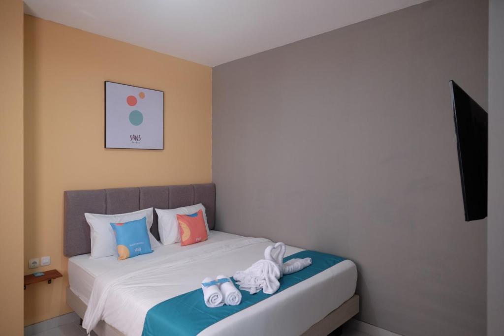 Postel nebo postele na pokoji v ubytování Sans Hotel Fourth Loft Solo