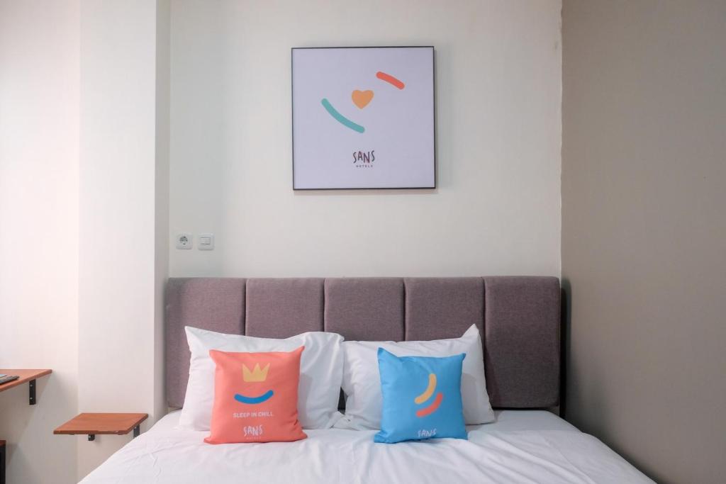 Postel nebo postele na pokoji v ubytování Sans Hotel Fourth Loft Solo