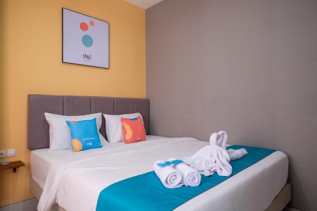 Postel nebo postele na pokoji v ubytování Sans Hotel Fourth Loft Solo