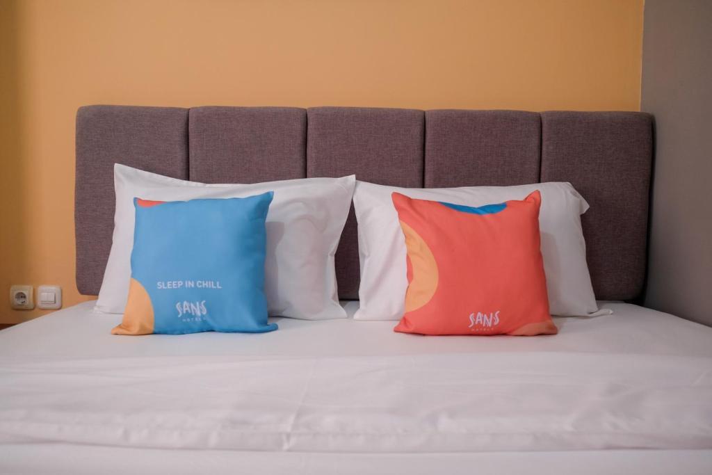 Postel nebo postele na pokoji v ubytování Sans Hotel Fourth Loft Solo