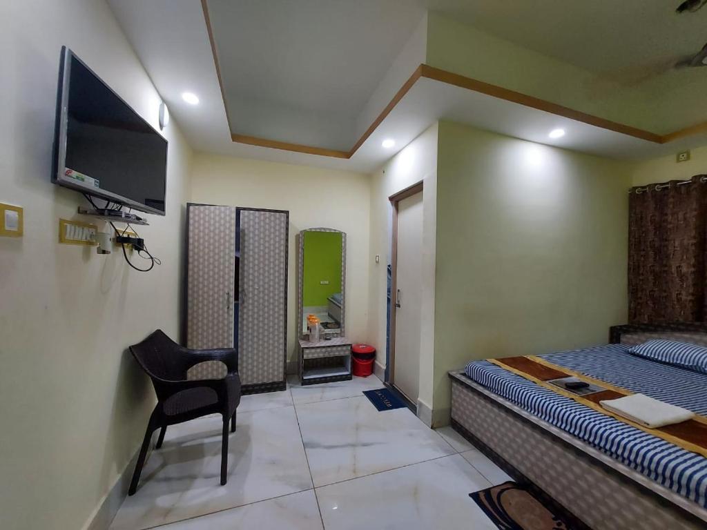 TV a/nebo společenská místnost v ubytování ICONIC Hotel Digha