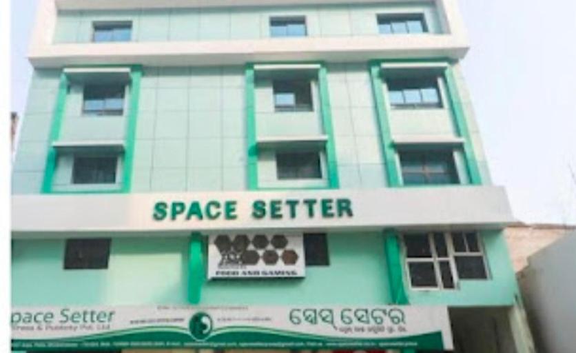 a green and white building with a space retailer sign on it at HOTEL SPACE SETTER in Bhubaneshwar