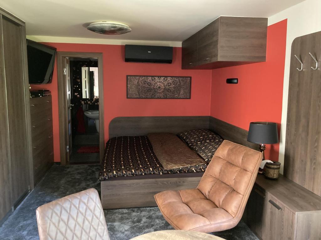 Ein Bett oder Betten in einem Zimmer der Unterkunft UNIQUM