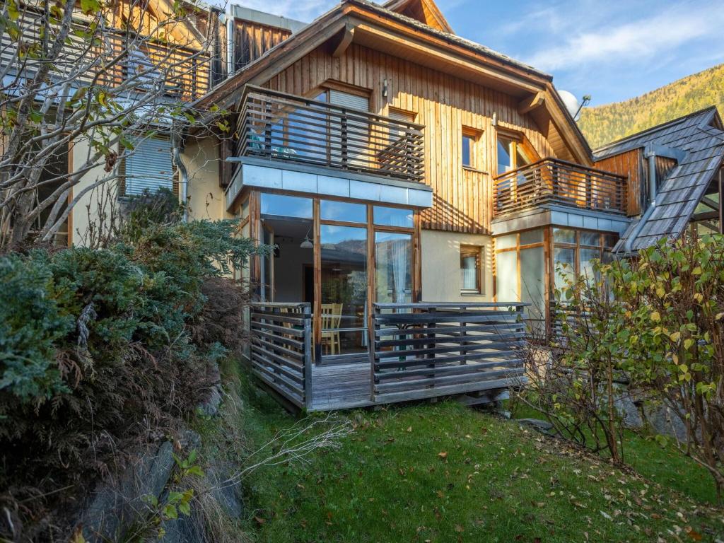 a house with a large deck on the side of it at Apartment in Bad Kleinkirchheim in ski area in Bad Kleinkirchheim