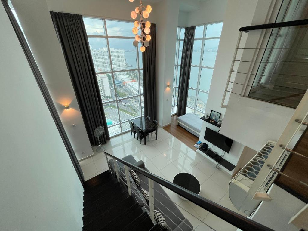 an aerial view of a living room with windows at Premier Suite at Maritime in George Town