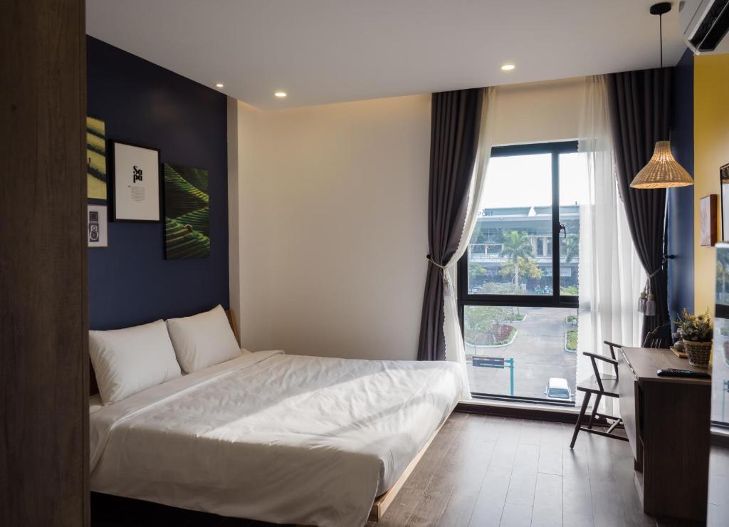Ein Bett oder Betten in einem Zimmer der Unterkunft Wings House