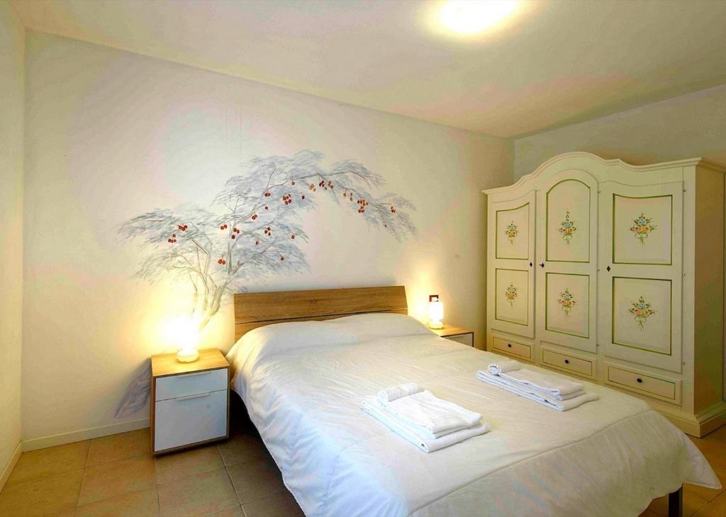 Łóżko lub łóżka w pokoju w obiekcie Residence con piscina a 4 km da Baja Sardinia