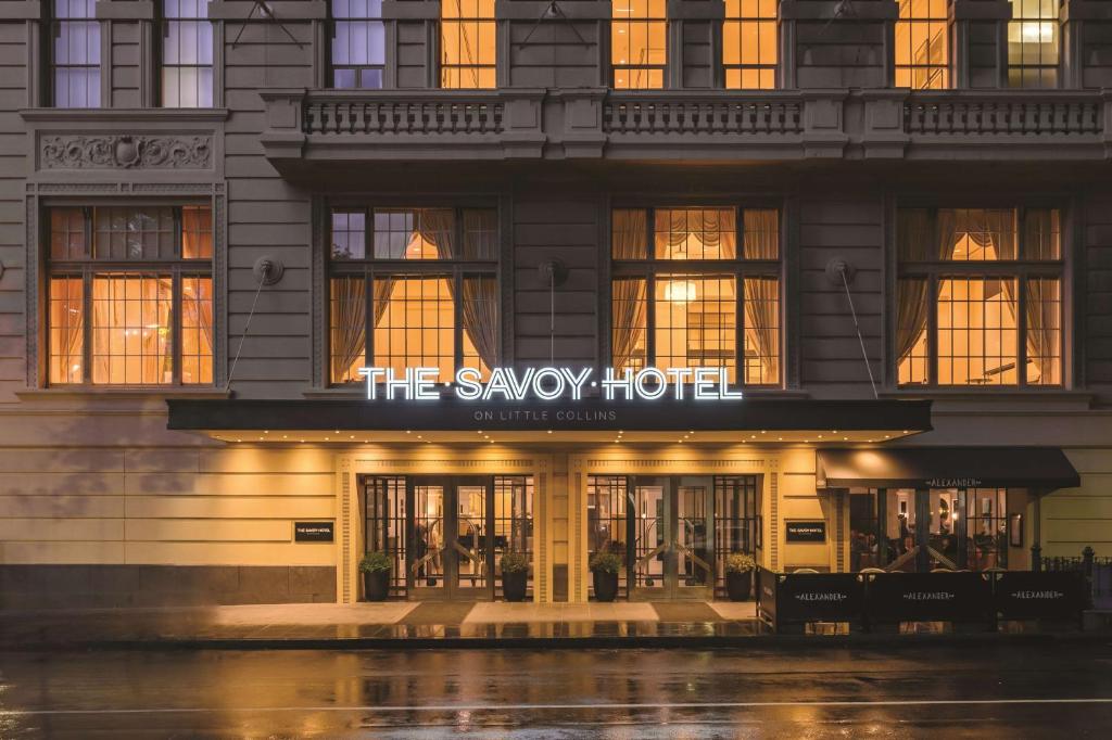 a building with a sign on the side of it at The Savoy Hotel on Little Collins Melbourne in Melbourne