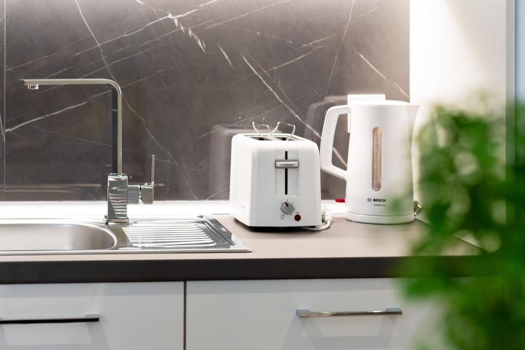 Příslušenství pro přípravu čaje a kávy v ubytování Thess Residences