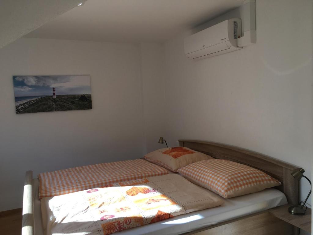 Postel nebo postele na pokoji v ubytování Sebastian Apartments