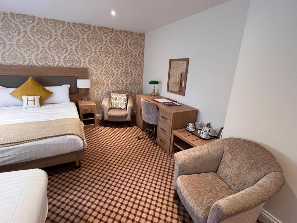 Postel nebo postele na pokoji v ubytování Haley's Hotel