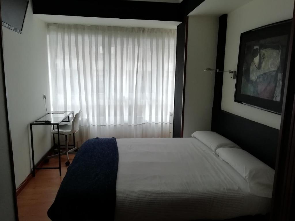 Postel nebo postele na pokoji v ubytování Hostel Costa Gijon