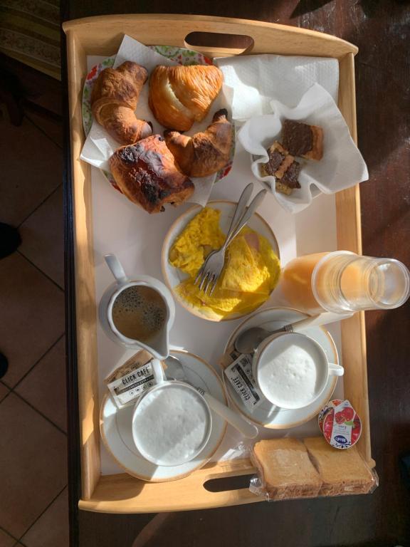 a wooden tray filled with different types of food at Casale della rosa in Loreto