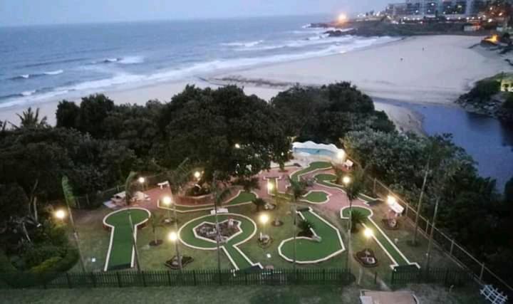 an aerial view of a park near the beach at night at 102 Santana Holiday Resort in Margate