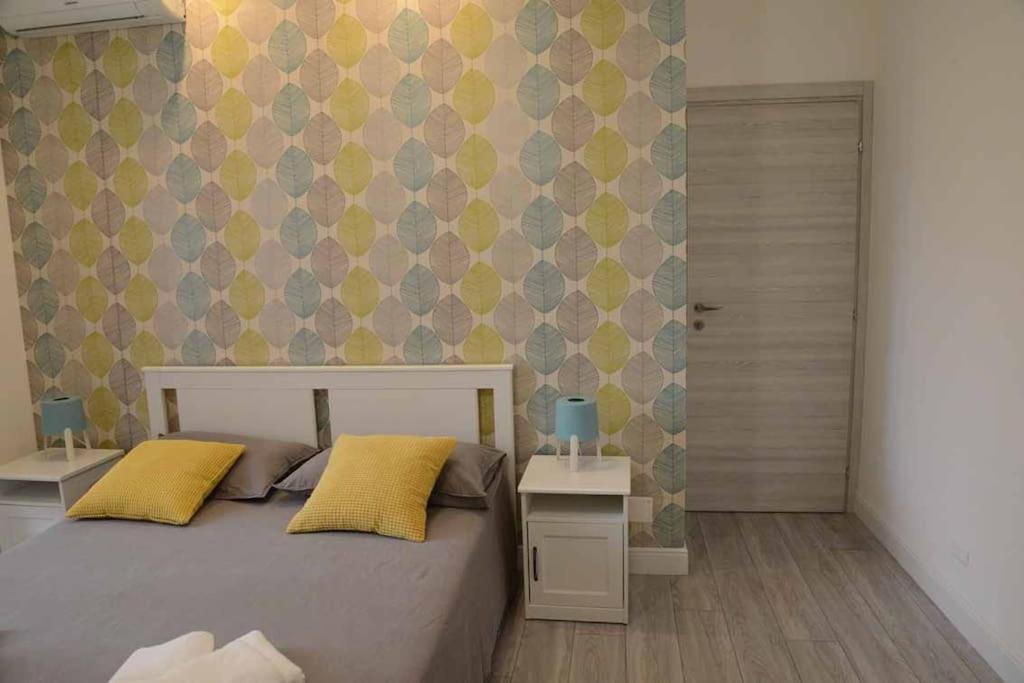 A bed or beds in a room at Casa e Appartamenti per Vacanze Jenner