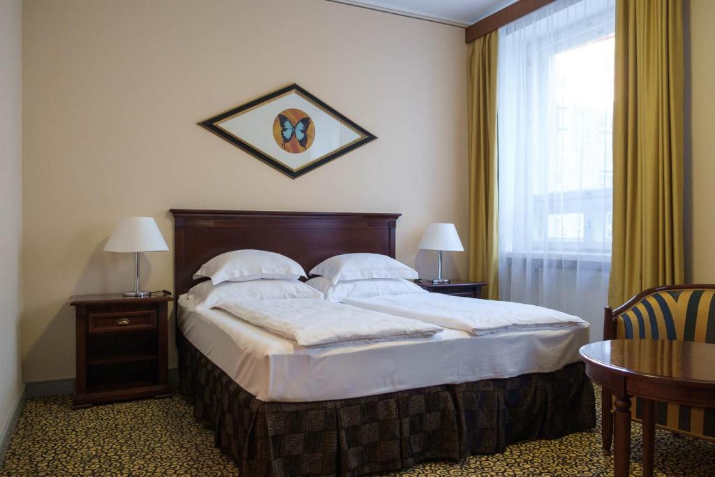 Postel nebo postele na pokoji v ubytování Grand Hotel Viljandi