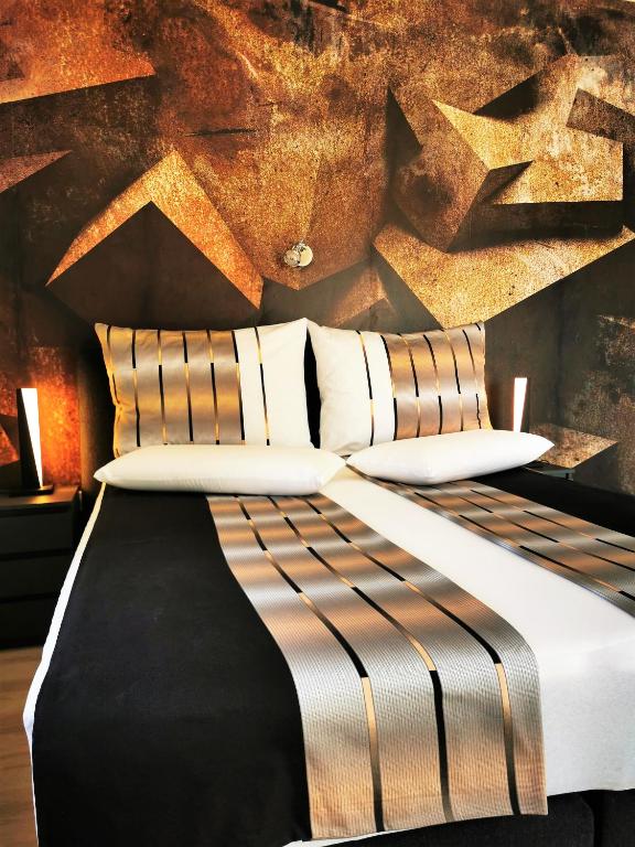 Łóżko lub łóżka w pokoju w obiekcie Apartments Petar Pan