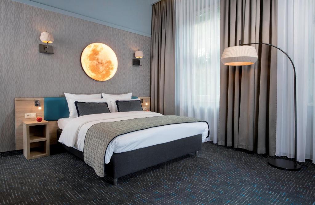 Posteľ alebo postele v izbe v ubytovaní Leonardo Boutique Hotel Krakow Old Town
