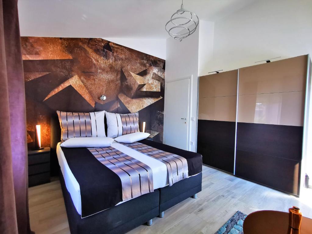 Łóżko lub łóżka w pokoju w obiekcie Apartments Petar Pan